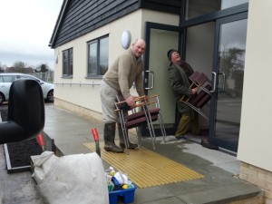 moving chairs into hall