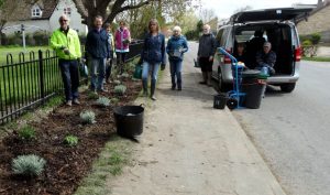Volunteers planting the new border next to the playground