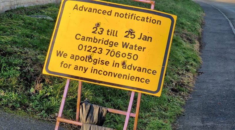 Image of yellow road sign with dates and contact phone number, advising of closure of Angle End road.