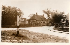 Image of a postcard, circa 1958, depicting Pond Corner at the junction of Church Street and High Street, Great Wilbraham. The pond is no longer evident.