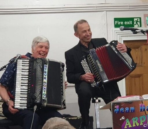 Image of a female and male accordionist